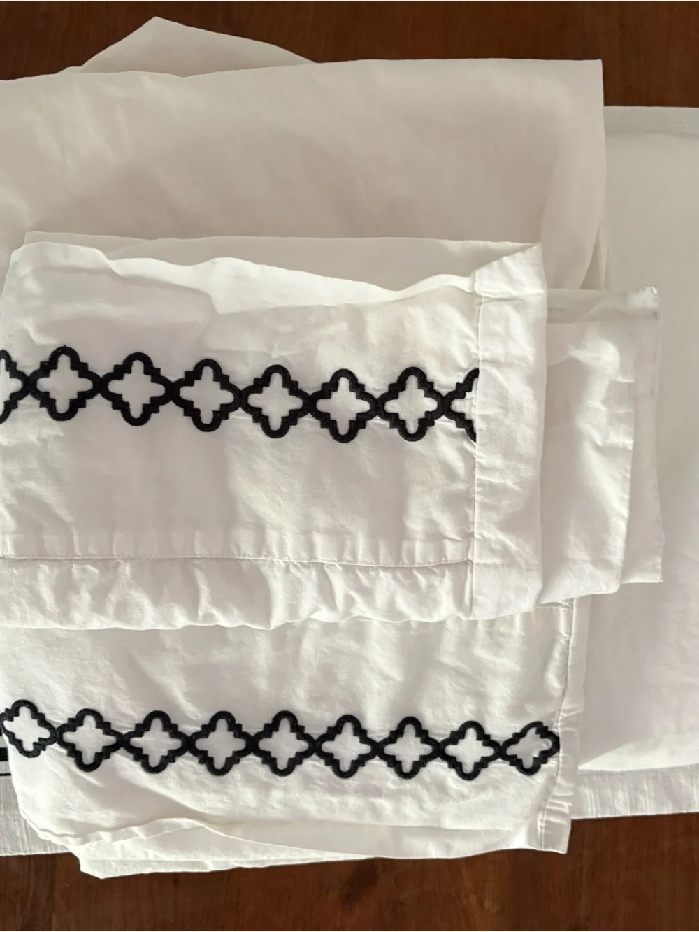White Pillowcases with Black Embroidered Trellis Border